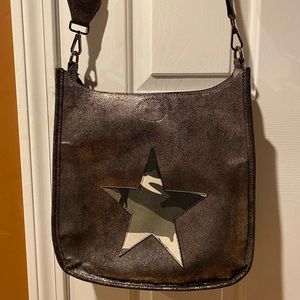 Metallic cross body handbag with camouflage star
